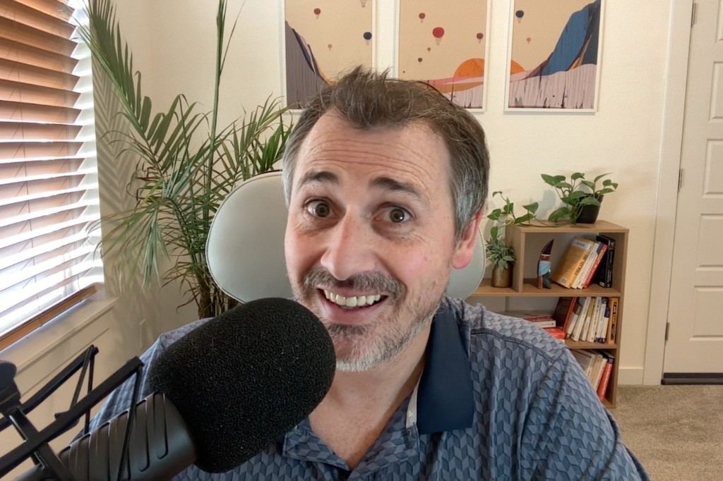 Joshua D. Thompson, founder of Brightbeam SEO, in his office